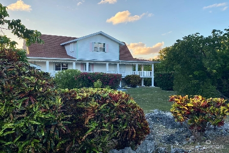 Cayman style home with cottage