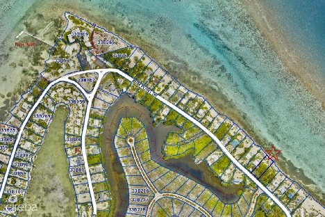 Rum point beachfront lot with coral reef