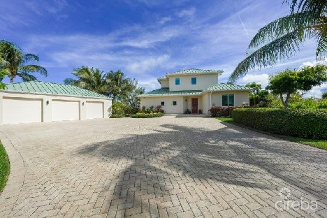 Unique patrick’s island canal front home with guest house and 3 car garage