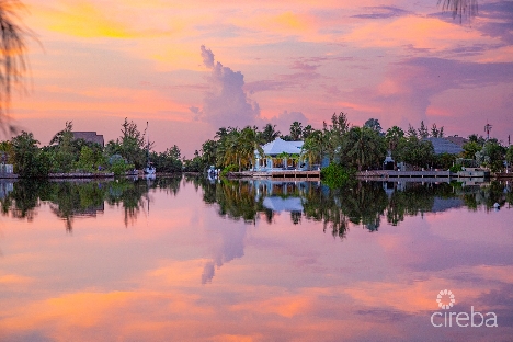 Canal front home on open water basin