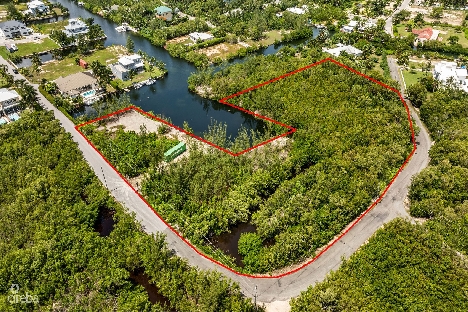 Prime 11.4-acre development opportunity with boat house potential in desirable red bay, heron bay