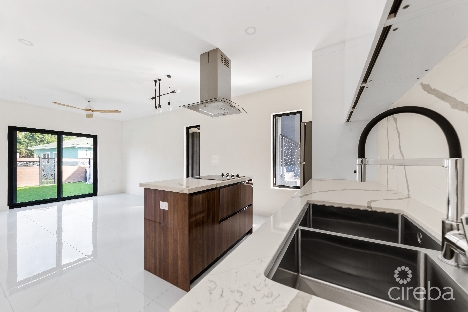 Arza west bay f1 . 2 bed + den end unit, private patio. inclusive of ci$ 17,000 furniture package