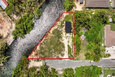 Chinaberry drive canal front lot