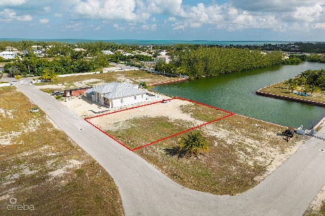 0.24 acre canal lot in gated community - mustique cove