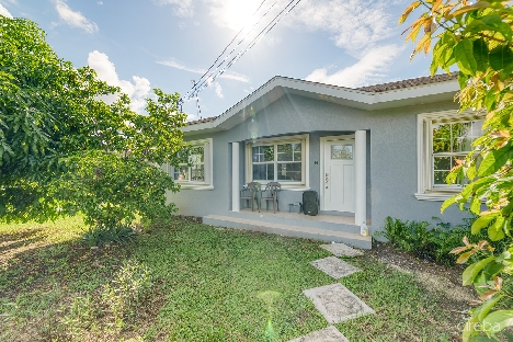 3 bedroom home on duplex lot w/approved plans for  additional 4-bedroom home