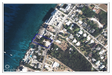 Rare 1.24-acre waterfront development site adjacent to sunset house