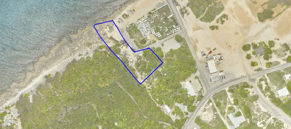 Oceanfront cayman brac land and house.