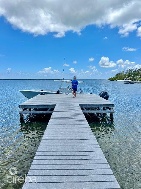 Cayman kai- water cay rd lot w/dock and 250ft of beachfront on little sound