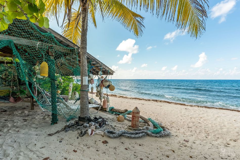 Tropical runaway – cayman brac beachfront